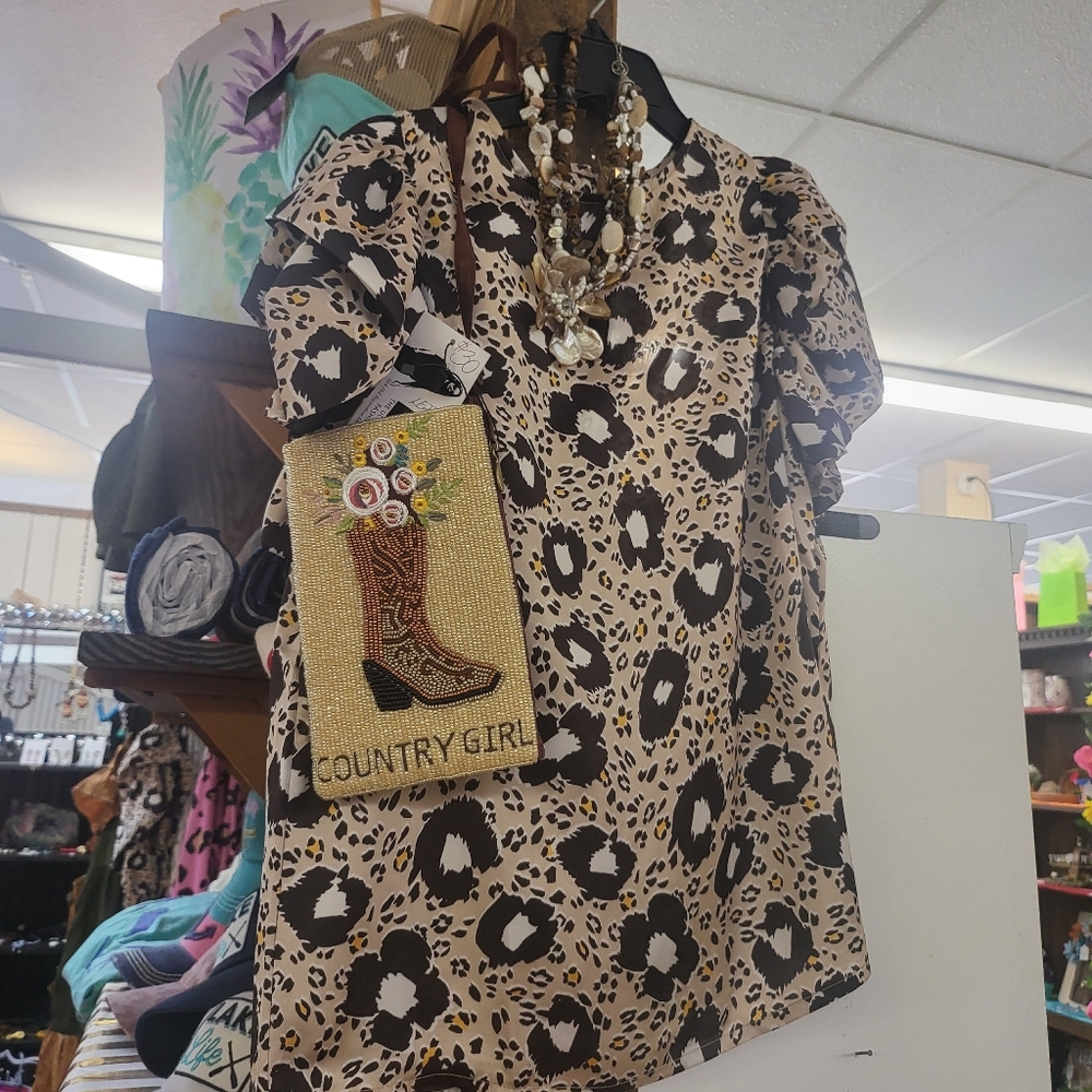 Leopard top with ruffle sleeves.